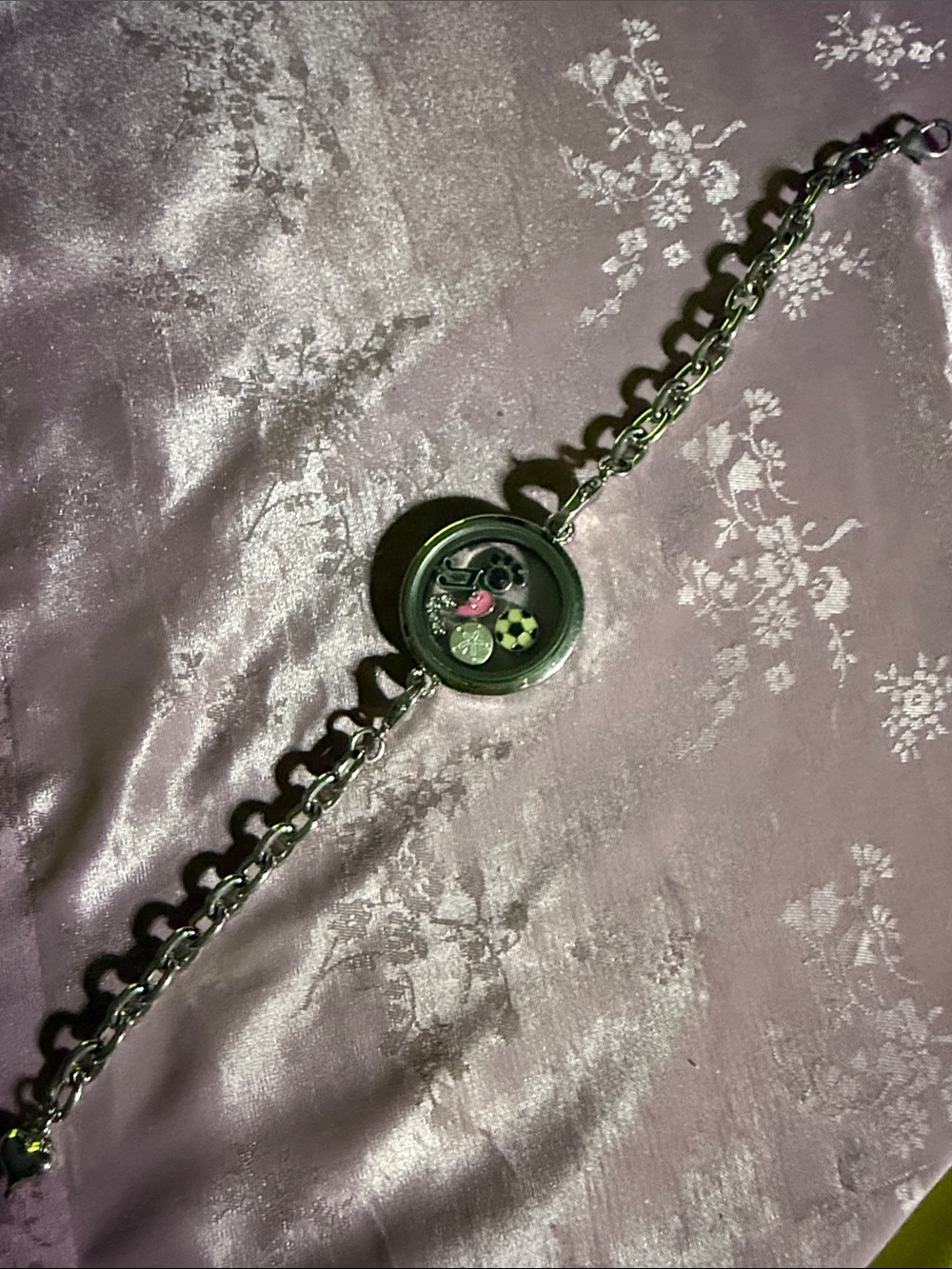 Origami owl? Charm bracelet.
